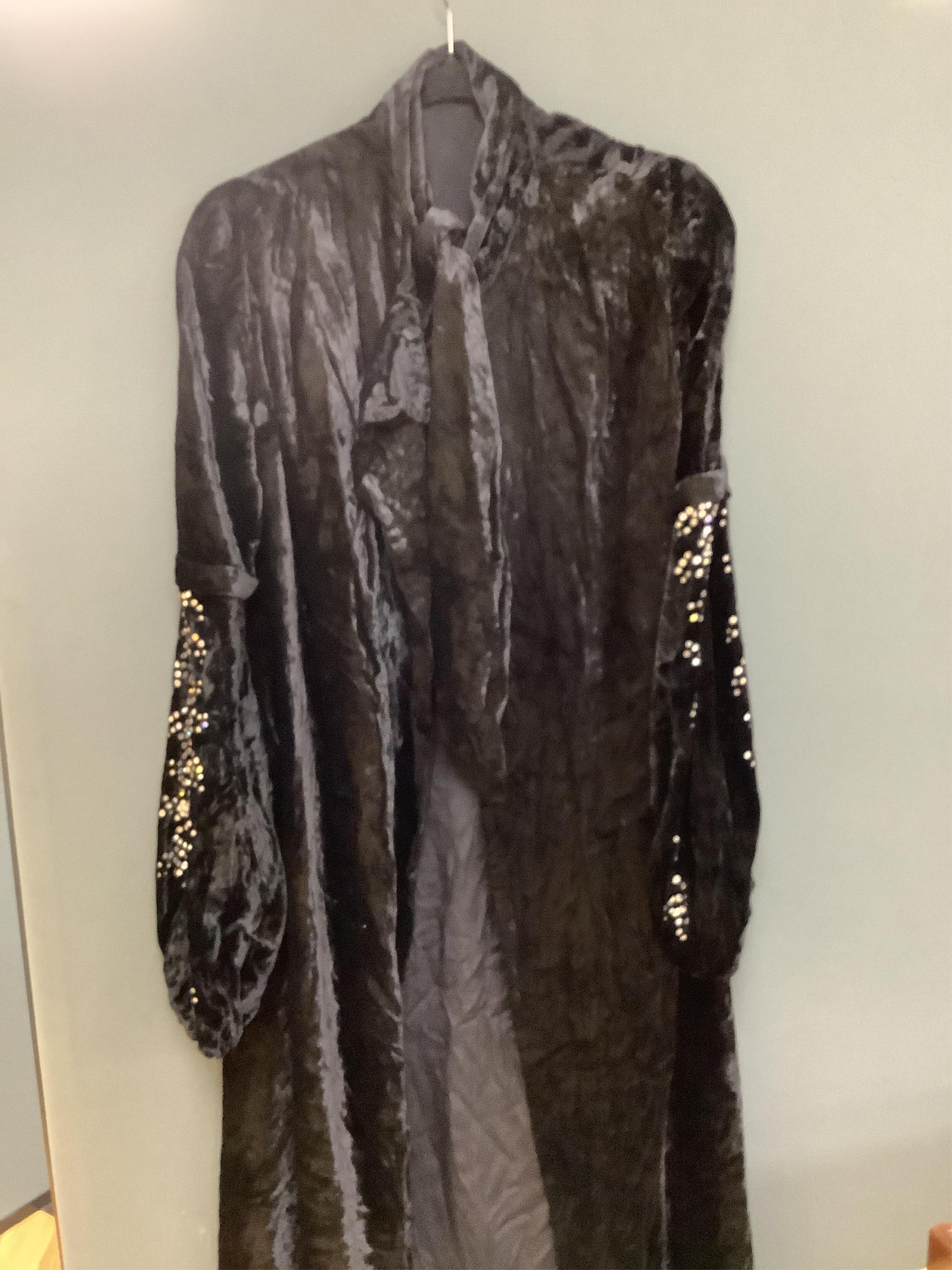Two Edwardian blouses and three earlier lace camisoles, three black satin partly sewn skirts and later black velvet diamonte decorated evening coat. Condition - the coat, skirts and blouses need repair but are good for T